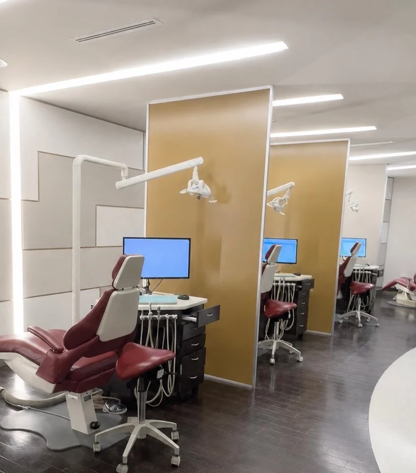 Orthodontic treatment chairs with individual monitors and overhead lights